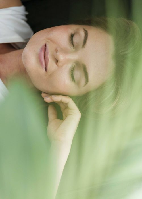 close-up-woman-green-plant