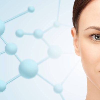 beauty, people and health concept - beautiful young woman face over blue background with molecules